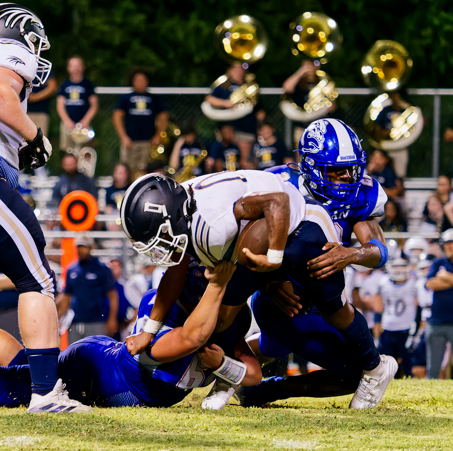 After several plays on the sideline after being somewhat hobbled, Devin Robertson immediately makes an impact on this tackle for loss. [more images from the Bulldogs' home-opener]